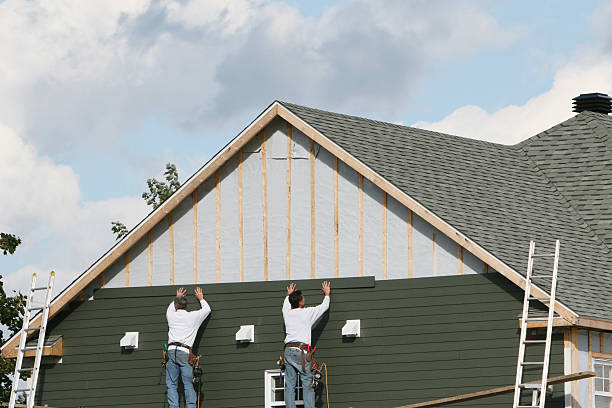 Professional Storm Damage Siding Repair technician working in Wolcott, CT